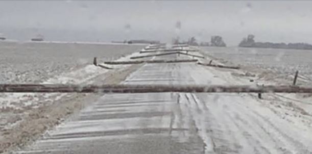 power line poles down in snow storm