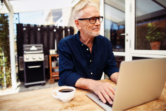 Man surfing the web on his patio