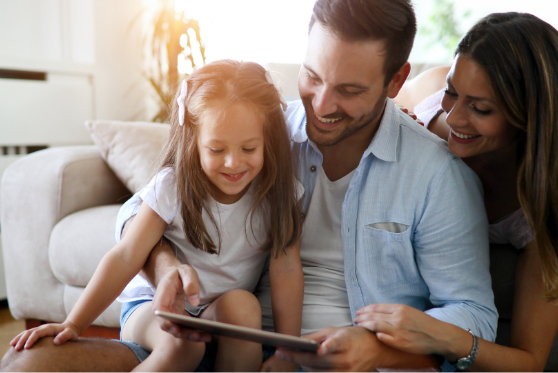 family looking at ipad